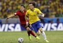Brazil's David Luiz races away from Mexico's Hector Herrera