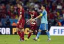 From left, Spain's Fernando Torres, Andres Iniesta and goalkeeper Iker Casillas walk off the pitch following their group B World Cup soccer match between Spain and Chile at the Maracana Stadium in Rio de Janeiro, Brazil