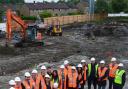 BUSY: VIPs get a look at the freshly cleared site as the Shadsworth Hub project enters the construction phase