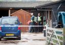 INVESTIGATION: Police officers at the stables in Old Stone Trough Lane, Kelbrook