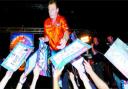 DAZZLER: Fans flock to the front of the stage to get Bobby George's autograph