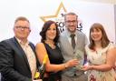 TOP TEAM: Paul Hibbs, left, presents the award to Laura Miller, Paul Burns and Tina Wilkinson of St Andrew’s CE Primary School, Oswaldtwistle