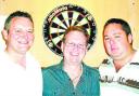 ON TARGET: Latest Bull and Royal qualifiers Tony Stone (left) and Jason Dewhurst (right) with pub andlord Andy Hunt