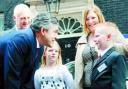 PREMIER MOMENT: Josh (right) and his family meet Gordon Brown outside Number Ten to receive the car keys