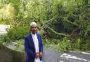 Cllr Hussain Akhtar, who represents the area on Blackburn with Darwen Council, stood infront of the large tree