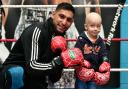 Oliver Welch aged three who is suffering from a rare form of cancer, met Amir Khan at his gym in Bolton.