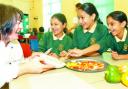 TASTY: Chef Philippa James shares food with pupils Humaira Patel, Zakiyya Golita and Zeba Musa