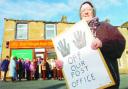 MAKING A STAND: Protesters including Irene Lindsay (front) gather outside the under-threat Hapton Post Office