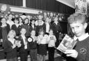 SOUNDS GREAT: Nine-year-old George Nuttall with fellow pupils and the CDs they created in memory of murdered schoolboy Joe Geeling