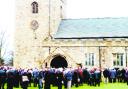 TEARS AND LOVE: The funeral service is relayed to hundreds of mourners outside St Mary's Church, in Gisburn