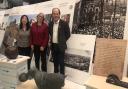 Wai-Tsau, Annette and Murray viewing the exhibition boards before installation commences.
