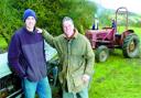 SELLING UP: David Hollings and son Adam with one of the tractors  for sale