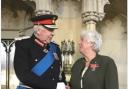 June Steele receiving her medal from Lord Shuttleworth