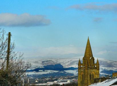 Holy Trinity Church in Oswaldtwistle, with pendle Hill in the background