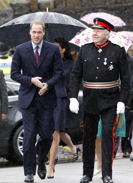 Prince William and Kate Middleton arrive in a rainy Darwen.