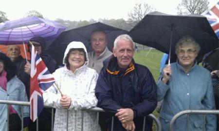Crowds braving the weather at Witton Park ahead of the royal visit.