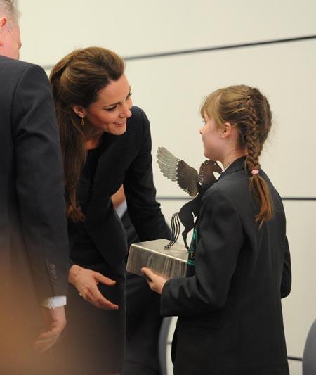 Kate Middleton presents an awards to DACA student Jessica Dootson.
