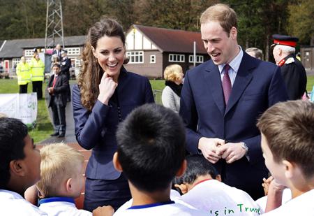 Kate Middleton and Prince William chat to young athletes at Witton Park.