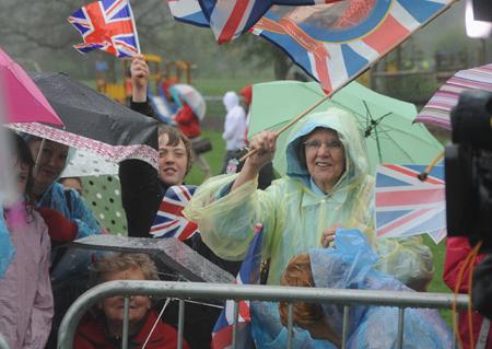 Rain didn't deter these fans waiting for Prince William and Kate Middleton at Witton Park.