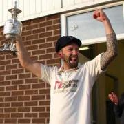 Dan Pickup, Burnley captain, celebrates winning the Lancashire League title in 2019