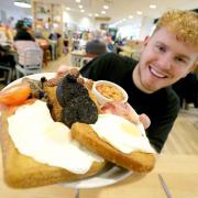 Customer Robert Trigg tries the Morrisons Black Fry-Day breakfast. Photo credit should read: Nigel Roddis/PA Wire