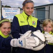 HANDS ON: Jazz Elliott, centre, with her sisters Jade and Justine at Rovers’ centre of excellence