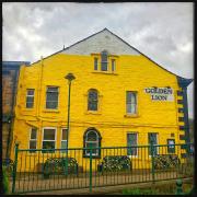 Golden Lion 2 - Gable end of Todmorden pub painted yellow