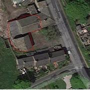 The application site with the barns edged in red