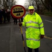 Peter Griffiths outside Worsthorne Primary School where he is the lollipop man
