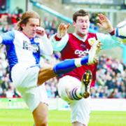 FOOT UP: David Nugent and Michel Salgado tangle for the ball
