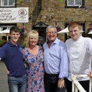 Steve and Christine Dilworth at the Swan with Two Necks pub in Pendleton, pictured with sons, left, Robert Dilworth and right, Michael Dilworth