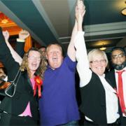 CELEBRATION: Labour’s Jim Smith celebrates with supporters  after winning Blackburn’s Mill Hill seat