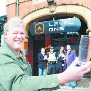SAFETY MEASURE: The launch of a new plastic ‘glass’ campaign at Level One night club, Warner Street, Accrington. From left, licensee Leon Kelly; Sgt Martin Knight; club owner Alison Frost; landlord Tony Dobson and holding the beaker is Accrington