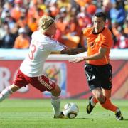 Holland striker Robin van Persie takes on Denmark opponent Simon Kjaer