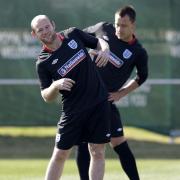ALL SMILES: England’s Wayne Rooney looked relaxed in training yesterday