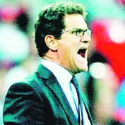 England striker happy to see Capello stay