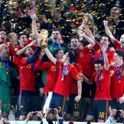 CELEBRATION TIME: Spain’s players show their delight after being presented with the World Cup last night