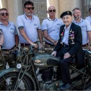 Lewis Banham, 100, sat on a bike he named 