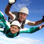A mock up of Kingswood Homes colleagues Liam Reilly and Luke Kenyon skydiving for Derian House
