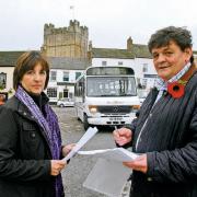 GAINING SUPPORT: Councillors Jill McMullon and Stuart Parsons collecting signatures for a petition against cuts to bus services