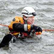 WATER DRAMA Darwen fireman Neil Cameron in the water