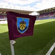 Two Burnley fans have been banned after fighting with opposition fans