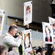 PROTESTS EDL activists with their placards featuring the faces of road accident victims