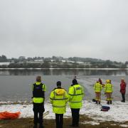 Police and fire rescuing a dog at Foulridge Reservoir