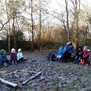 Children in the forest space at Little Stars Nursery at The Park Child and Family Centre on Norfolk Grove, Church