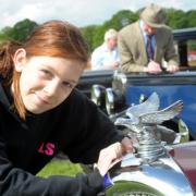 Kayleigh Sheridan admires a Riley Sports car