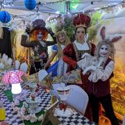 Alice at her Wonderland tea-party with other Lewis Carroll characters at a previous event in Barnoldswick.