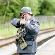 DON’T MENTION THE WAR A ‘German soldier’ in a re-enactment scene during a previous wartime weekend staged by the East Lancashire Railway