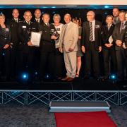 The Serious Collision Investigations Unit collect their Team of the Year award from Chief Constable Rowley and award sponsor Adrian Smith from PSL.