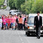 PINK PROCESSION Mourners dressed in Dylan’s favourite colour and wore “beanie hats” to pay their respects